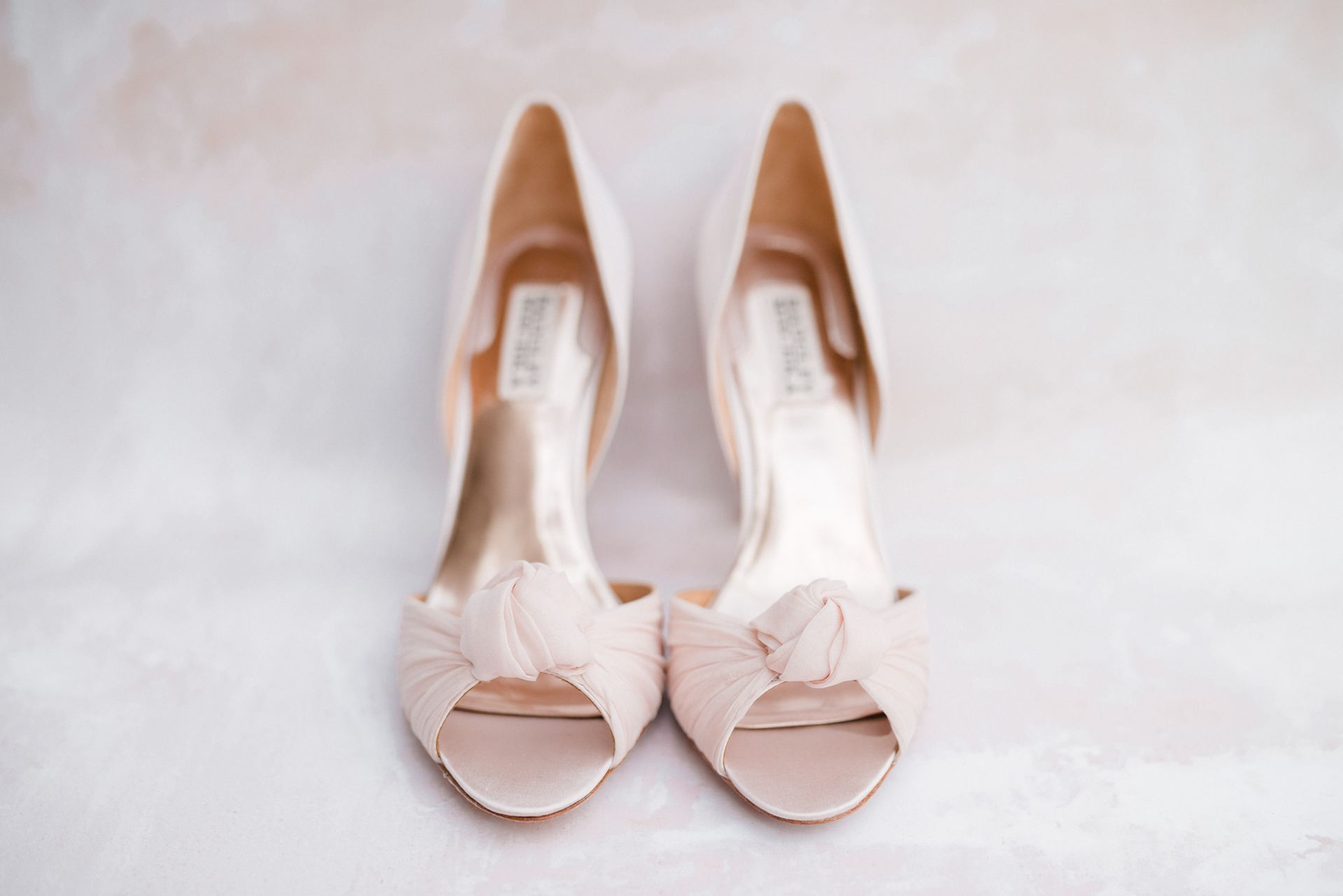 A pair of Womens pick open toed high heel shoes lined up