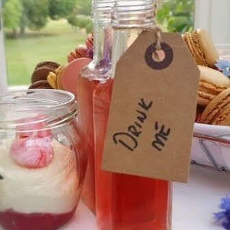brown tag on dessert table saying drink me