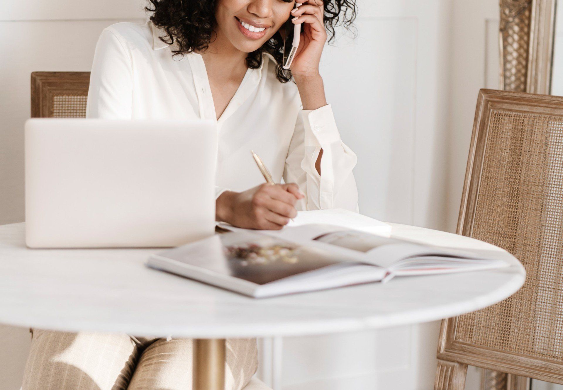 Wedding Planner sitting at desk talking on the phone