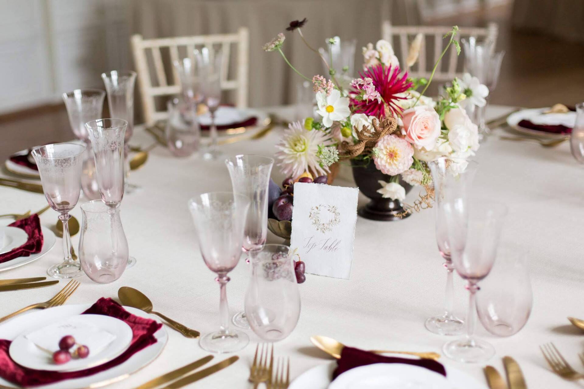 Elegant wedding round table burgundy velvet napkins dahlia flowers centrepieces