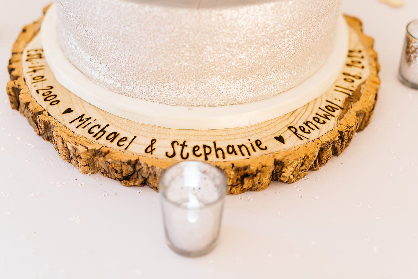Wooden slice cake stand engraved with wedding date