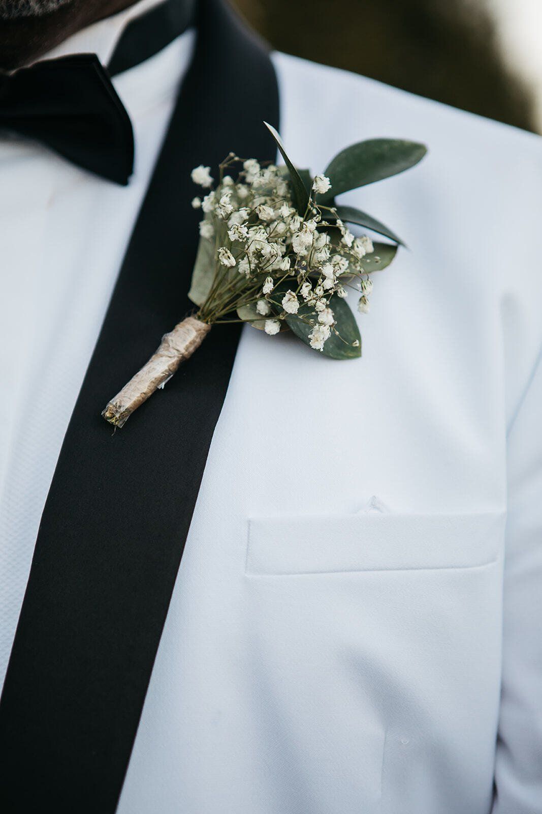 Grooms gypsophila flower button hole