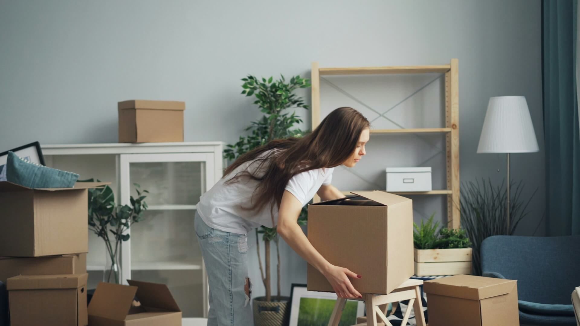 woman picking moving boxes