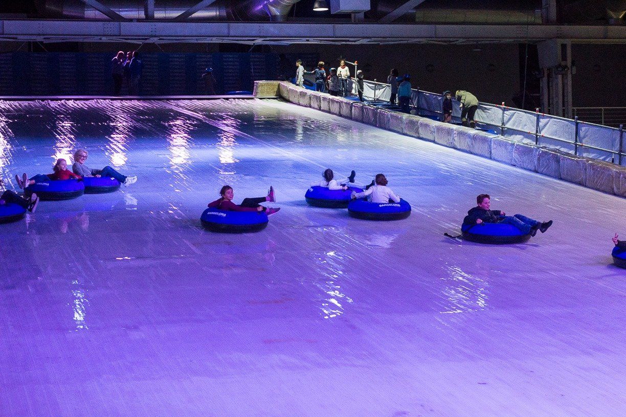 Full view of ice slide with riders