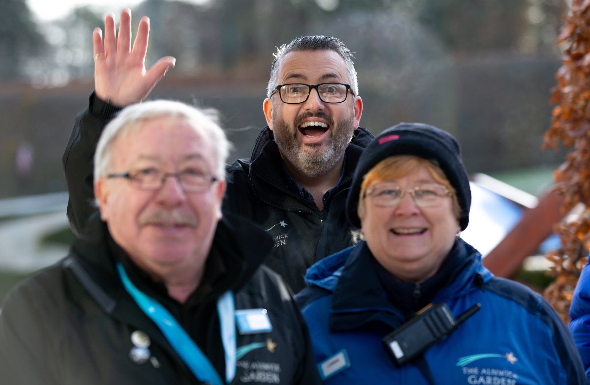 Care Crew with photo bomb waving