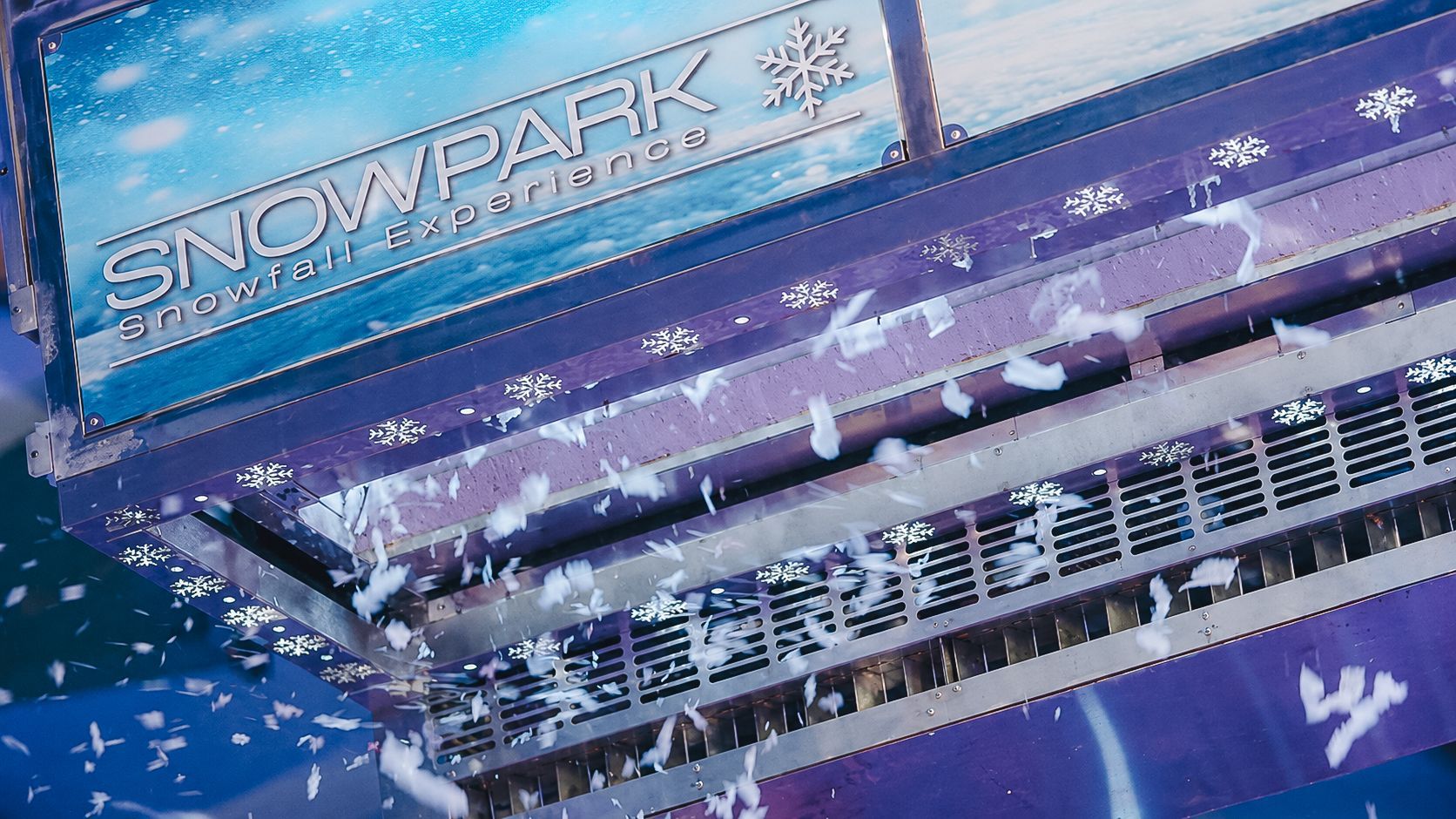 Over head fresh snow falling down from amazing machine