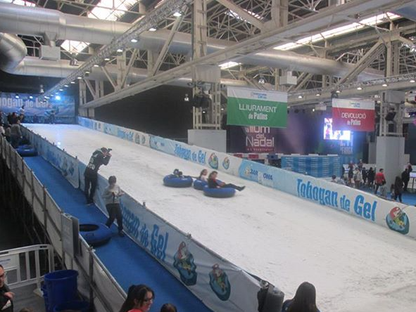 Riders descending a giant ice slide
