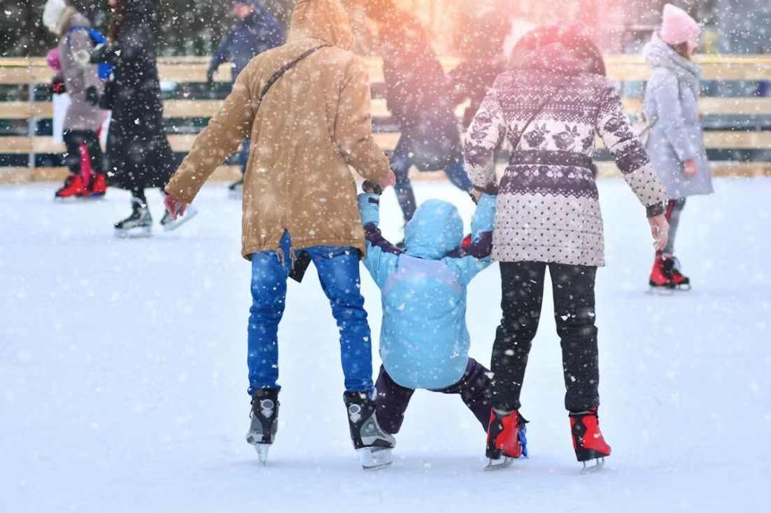 Kids playing in our Snow Play Park. Snow on the ground surrounded by trees