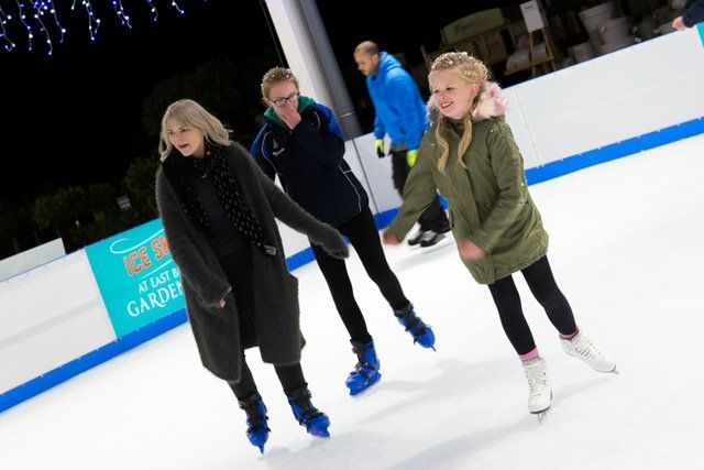 Mother and children ice skating in East Bridgford