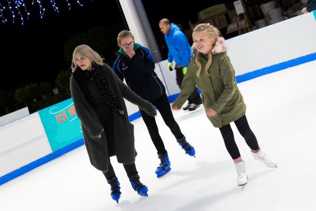 Skaters on ice rink having fun