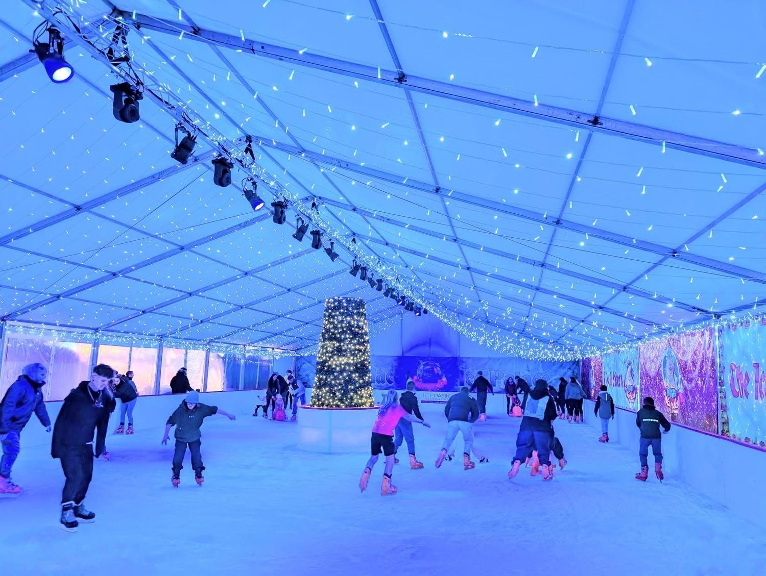 Kids playing in our Snow Play Park. Snow on the ground surrounded by trees