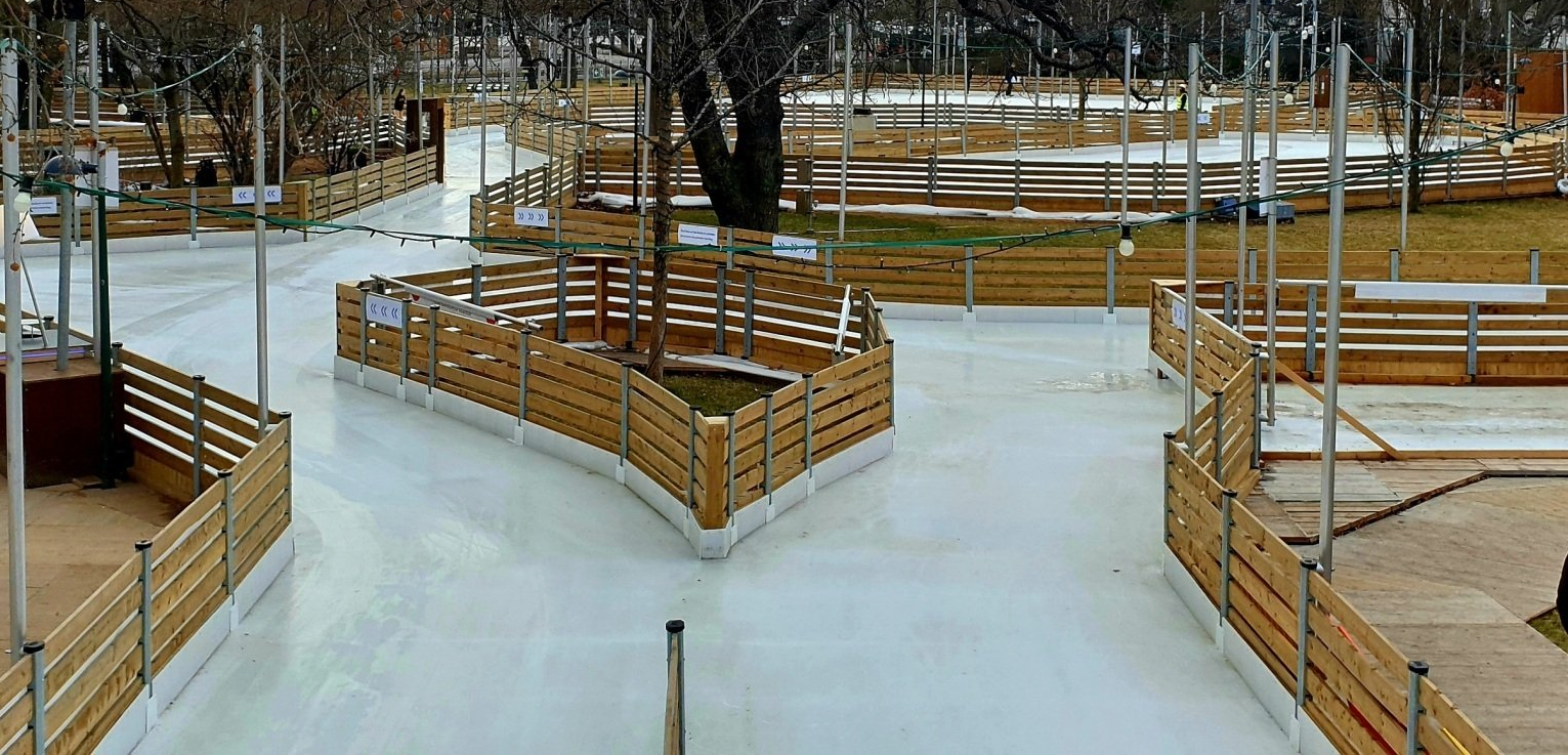 A maze of ice paths bordered with wood dashers.