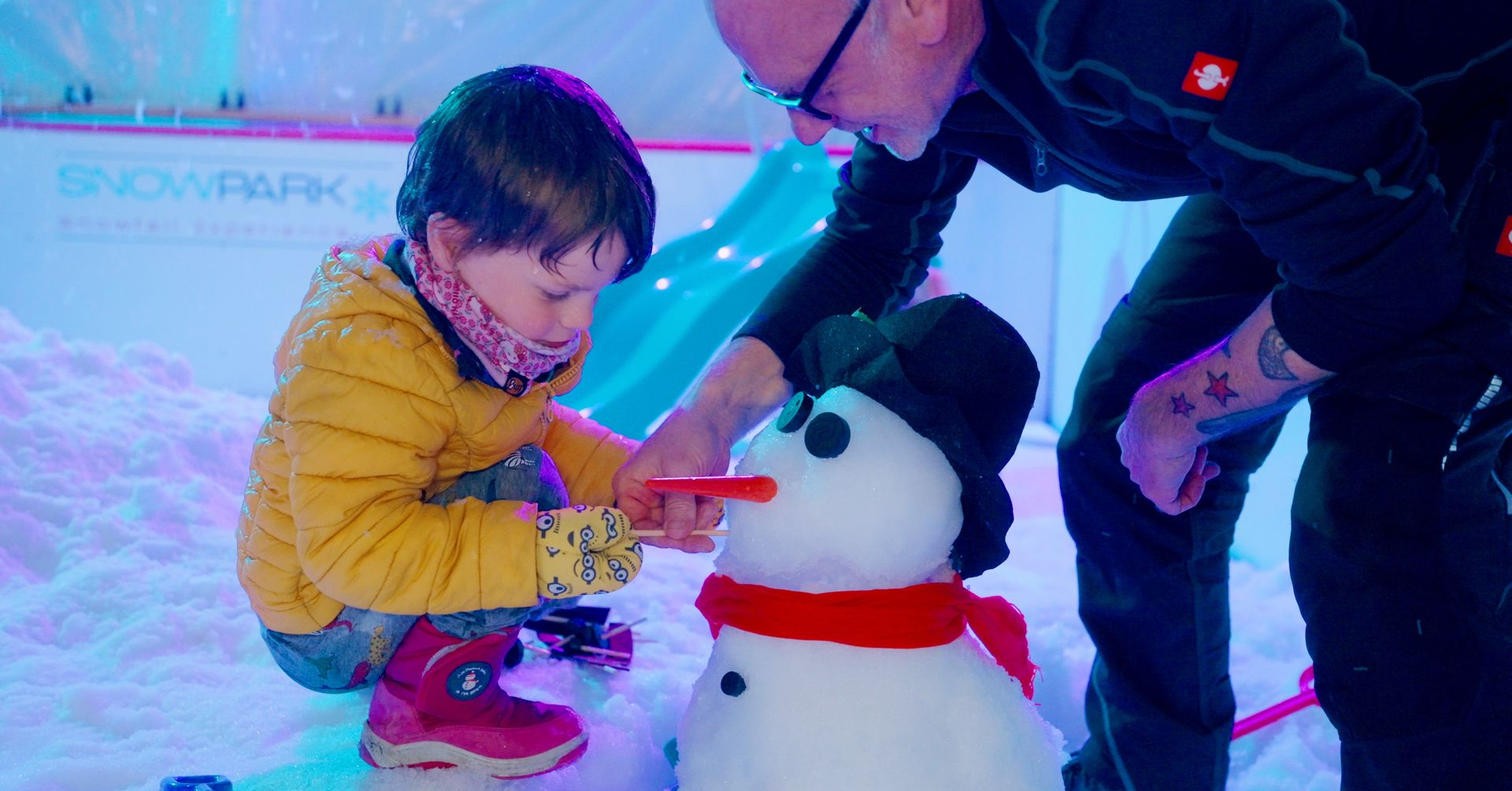 Snow falling from above with children playing below