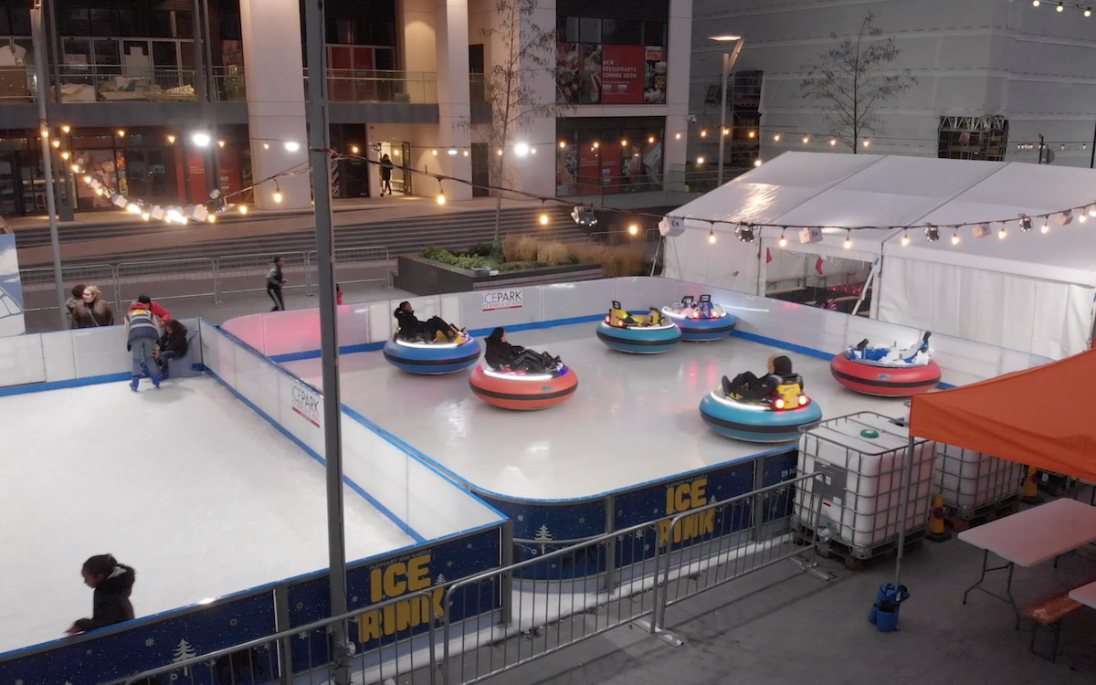 Ice Rink with skaters and Ice Bumper cars in London