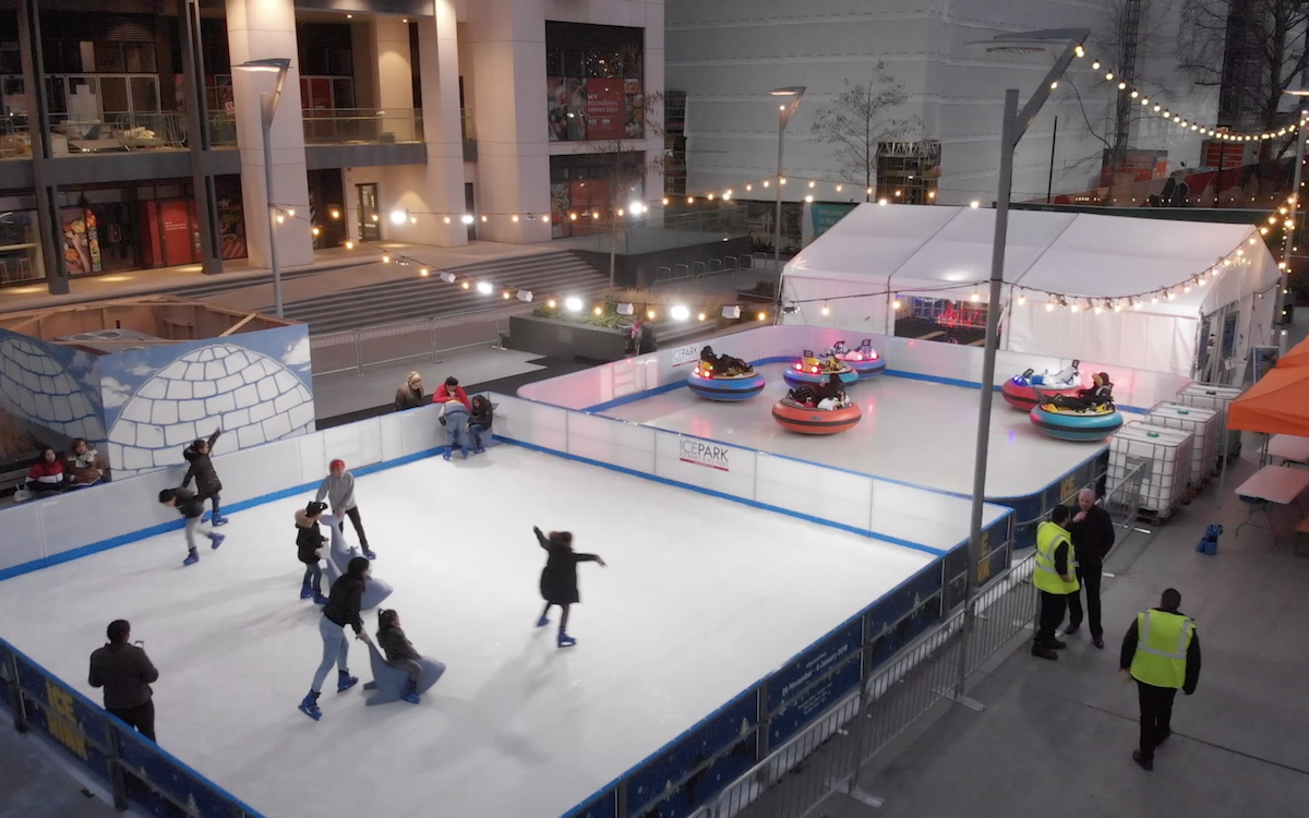 Ice Rink with skaters and Ice Bumper cars in London
