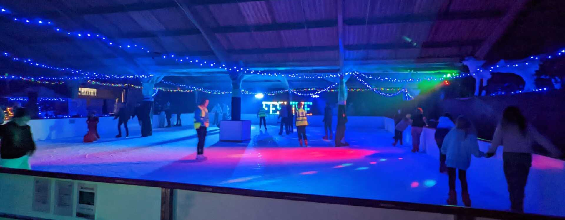 Kids playing in our Snow Play Park. Snow on the ground surrounded by trees