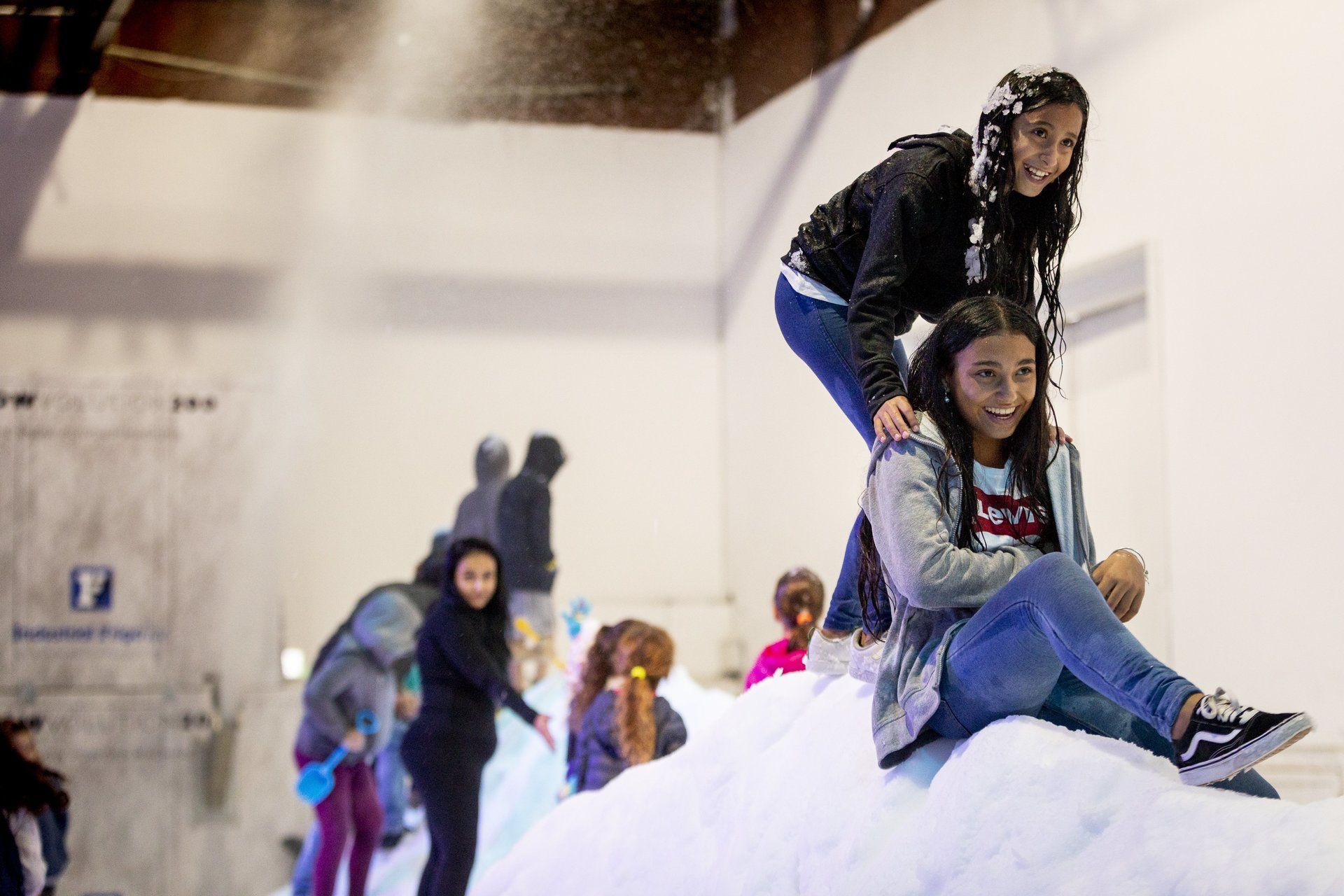 Children playing in snow playground