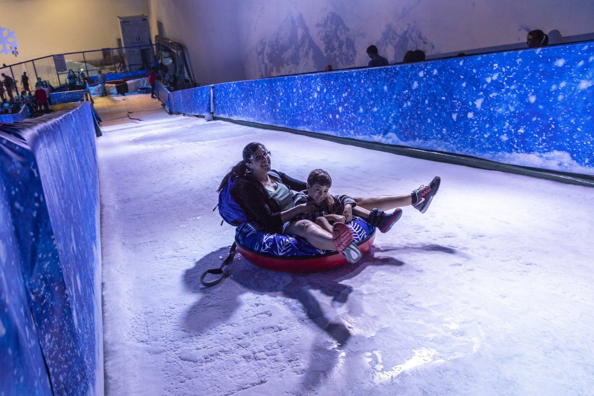 Full view of ice slide with riders