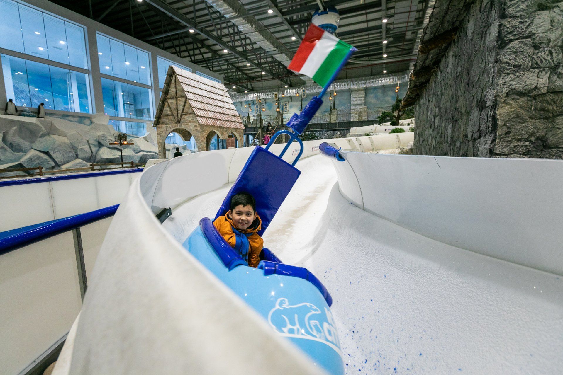 Bright blue bob with rider at speed