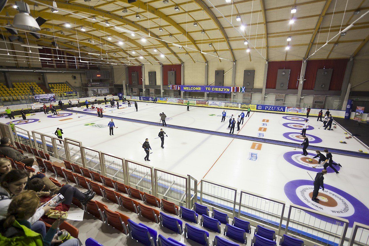 Full size ice hockey ice rink with players