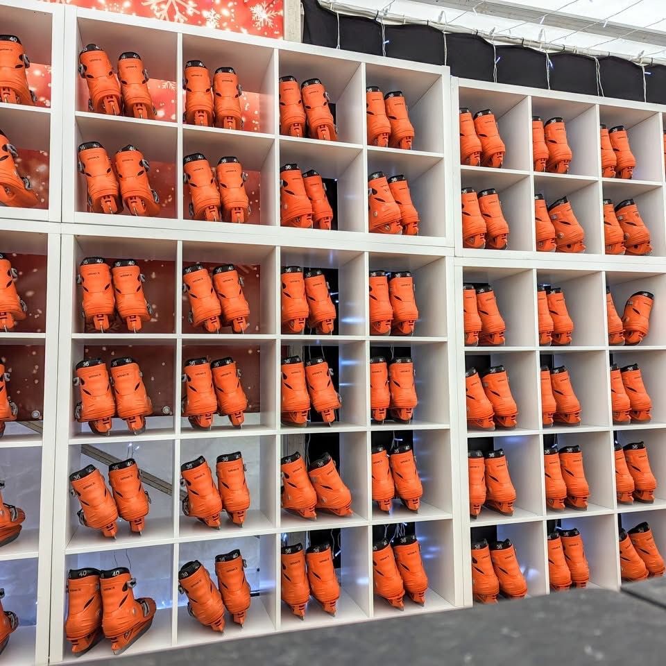 Huge rack of orange hire skates