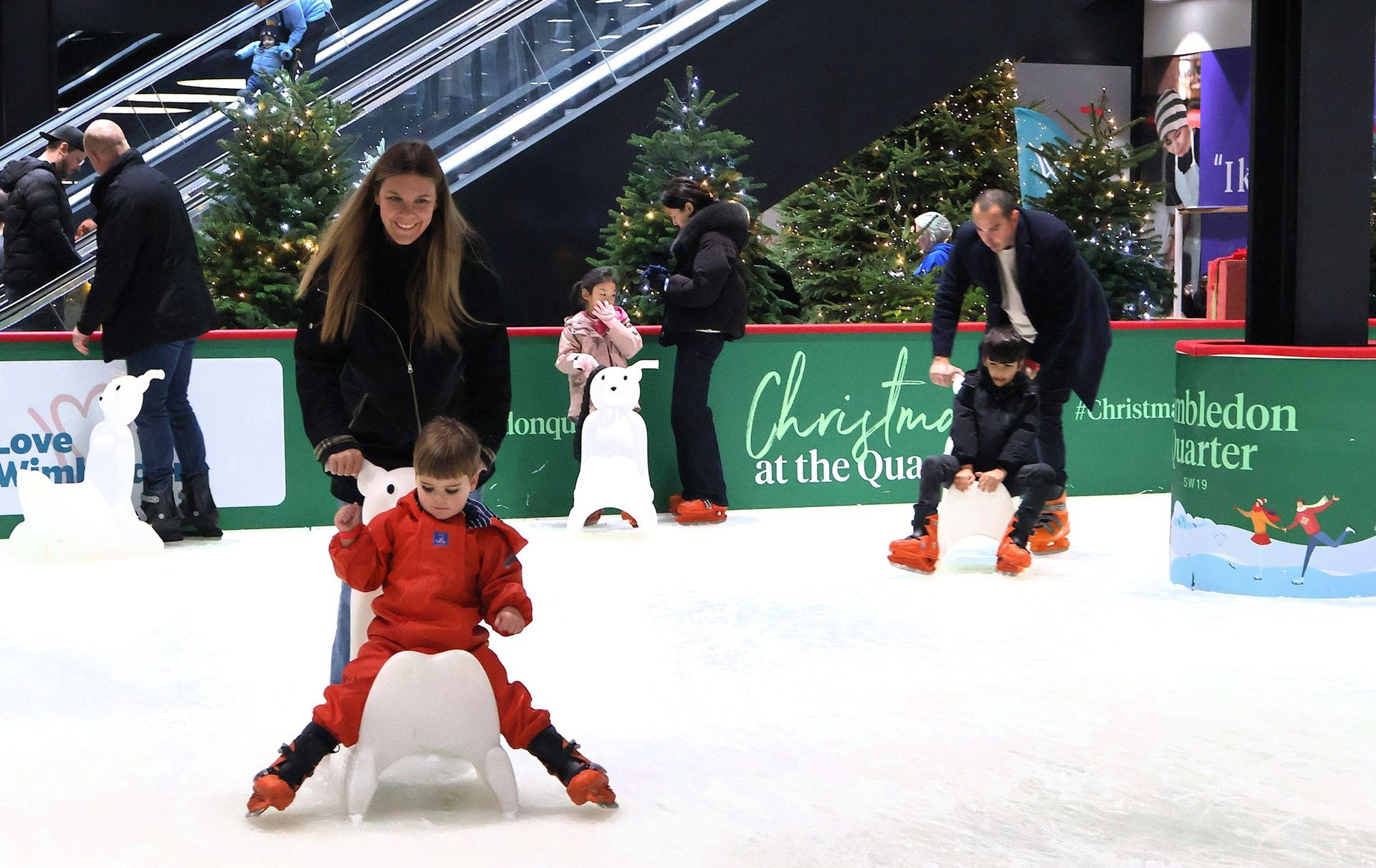 Kids playing in our Snow Play Park. Snow on the ground surrounded by trees