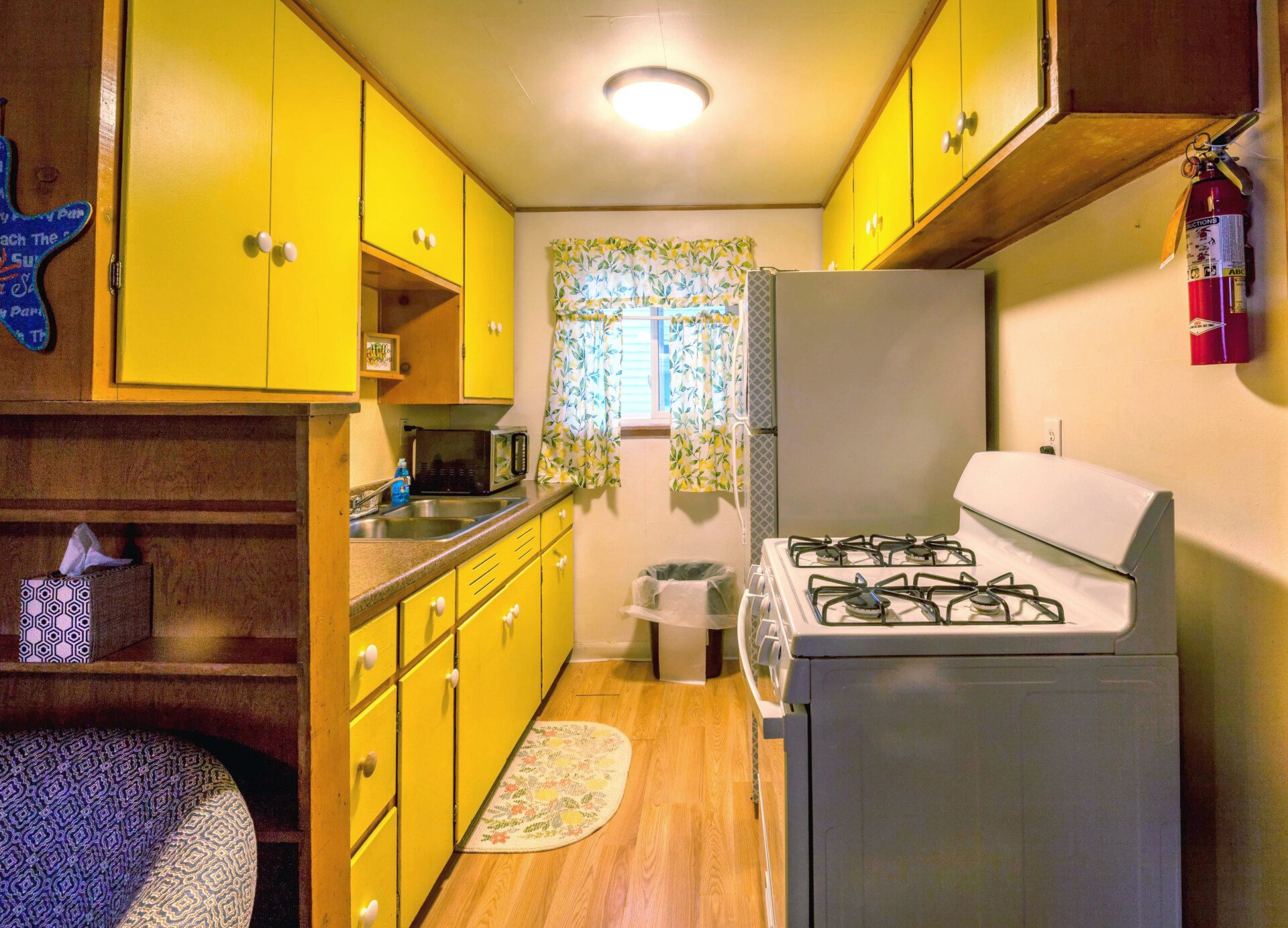 Colorful kitchens full of all utensils at Blue Horizon Court Pet Friendly Resort in Oscoda Michigan