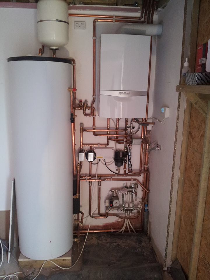 Gas boiler, unvented hot water cylinder and underfloor heating installation