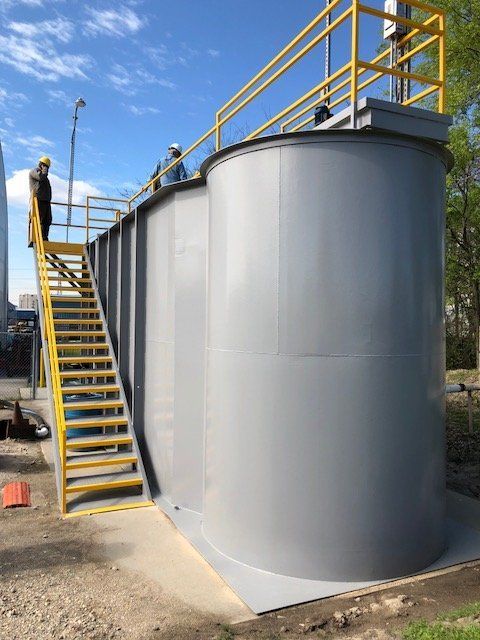 Men looking at a water treatment system