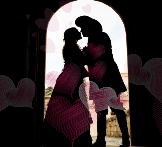 A silhouette of a lady and a lord about to kiss in in an archway