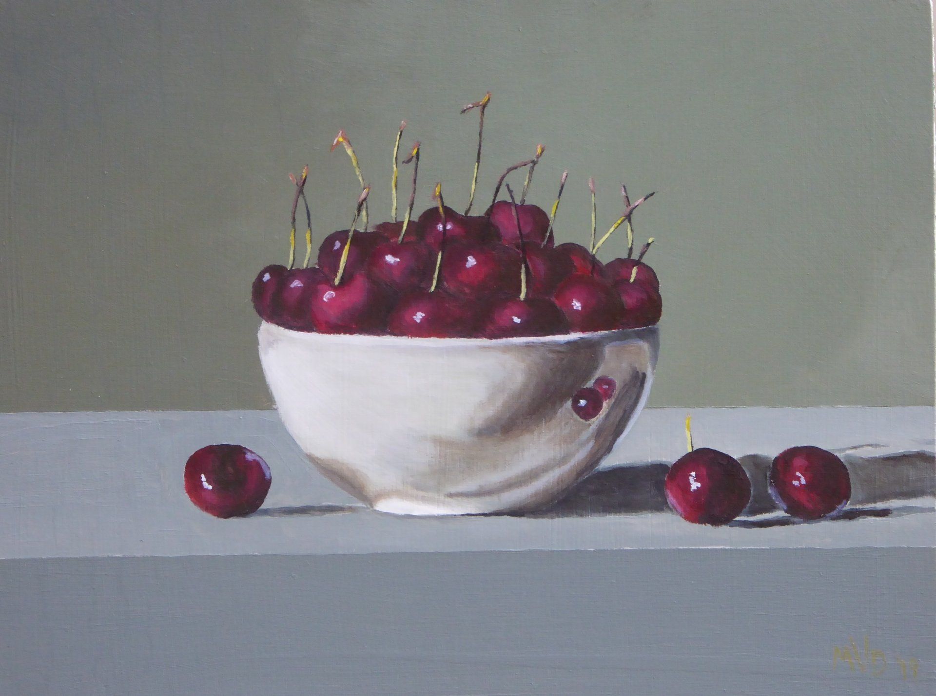 Still life of cherries in a white bowl