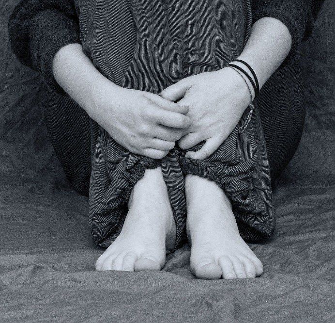 Male looking sad at a table