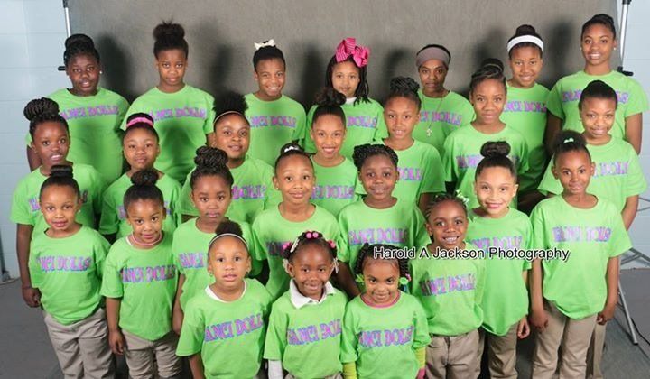 Group of School Children Wearing Matching Green Shirts