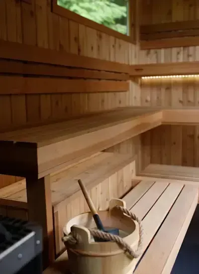 Torch gas sauna heater and a bucket of water just waiting for someone to toss some on the rocks!