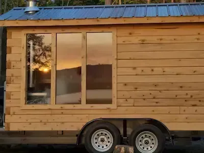 sunset and sauna with gas sauna heater in mobile sauna