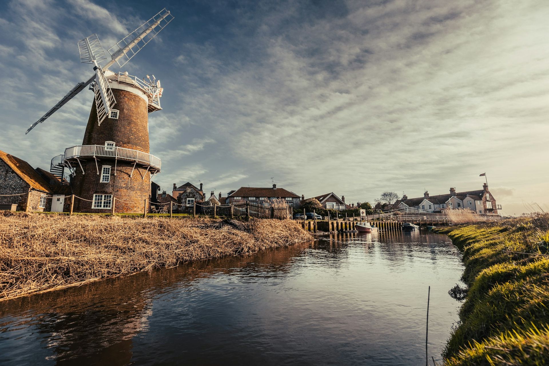 Only £8.99 Order Yours Today Brown windmill by canal with cloudy sky