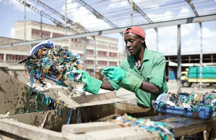 Man sorting plastic pollution