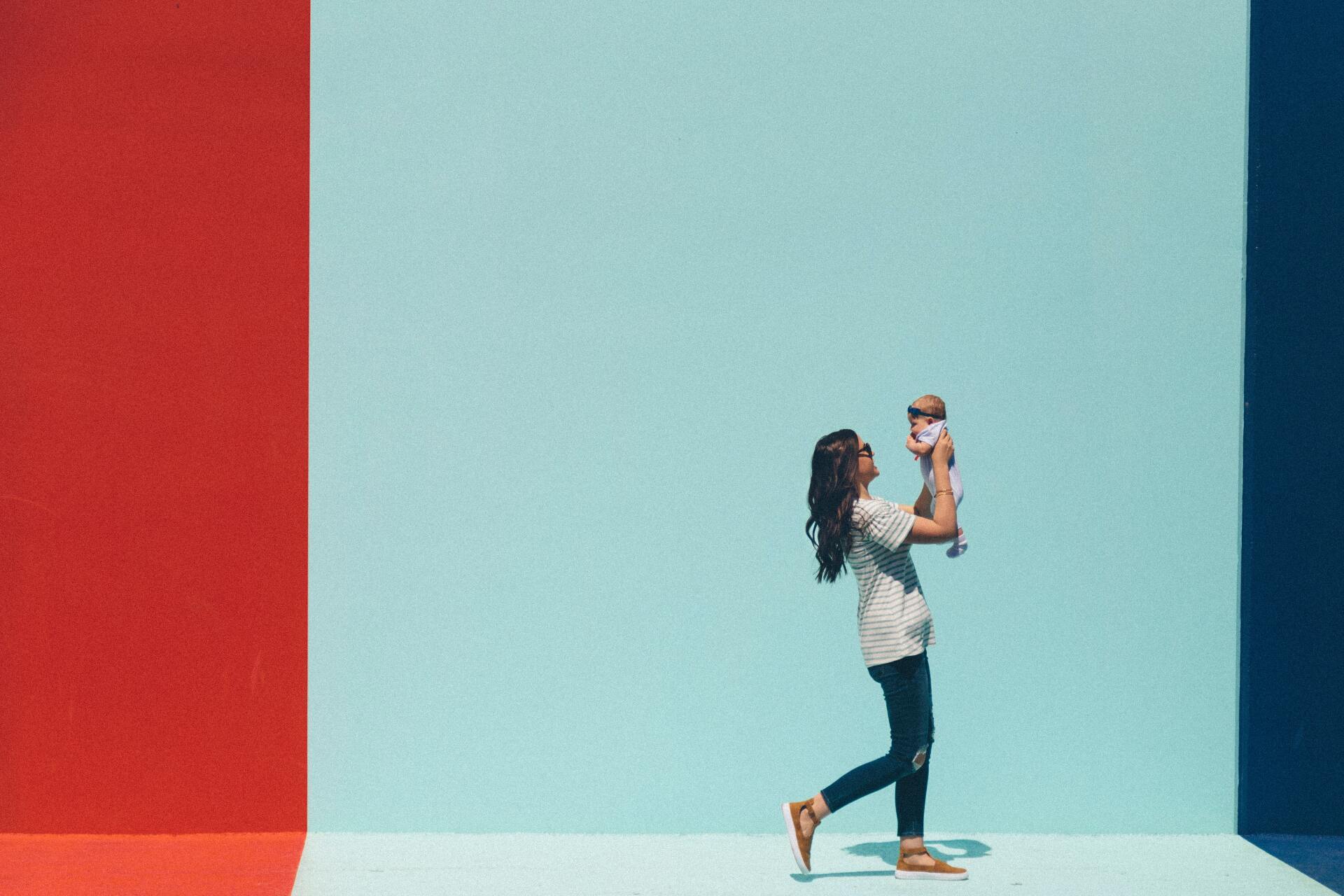 A mother with a baby.