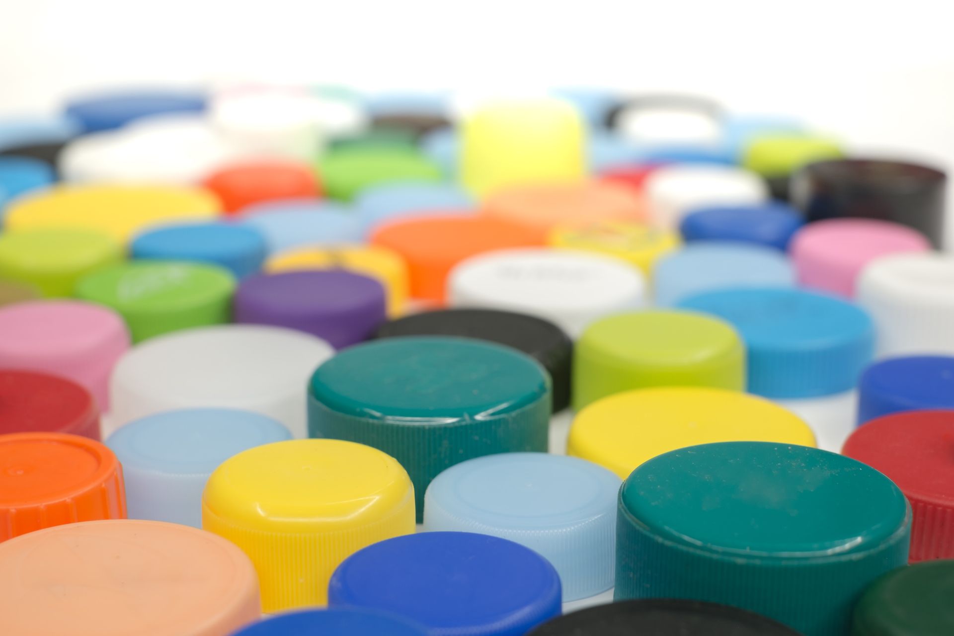Image by Roberto Sorin showing a close-up of many different colour bottle tops