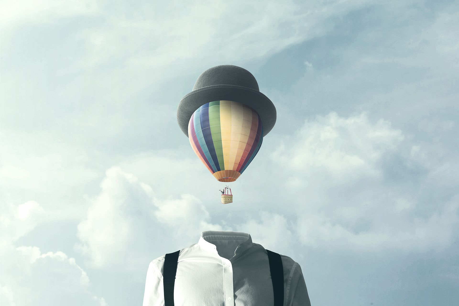 Abstract image of man with a big balloon in place of his head