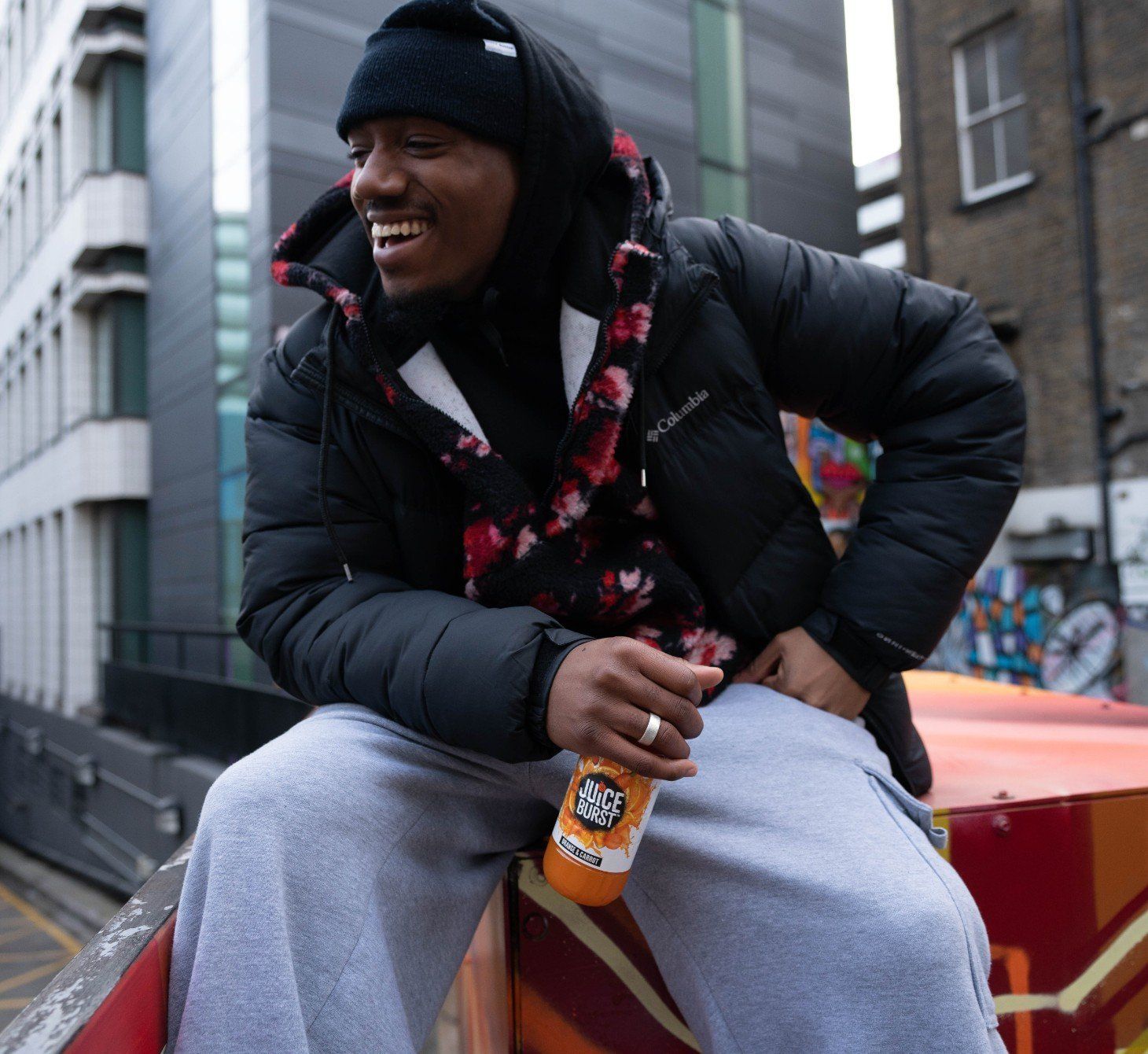 Man holding bottle of Juice Burst