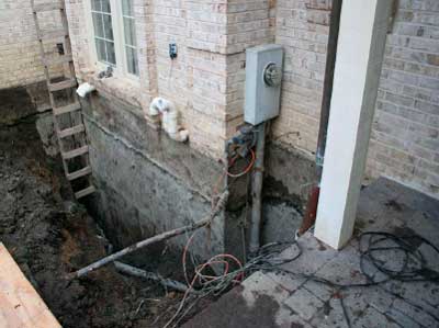 Trenching Around Home Foundation For Waterproofing