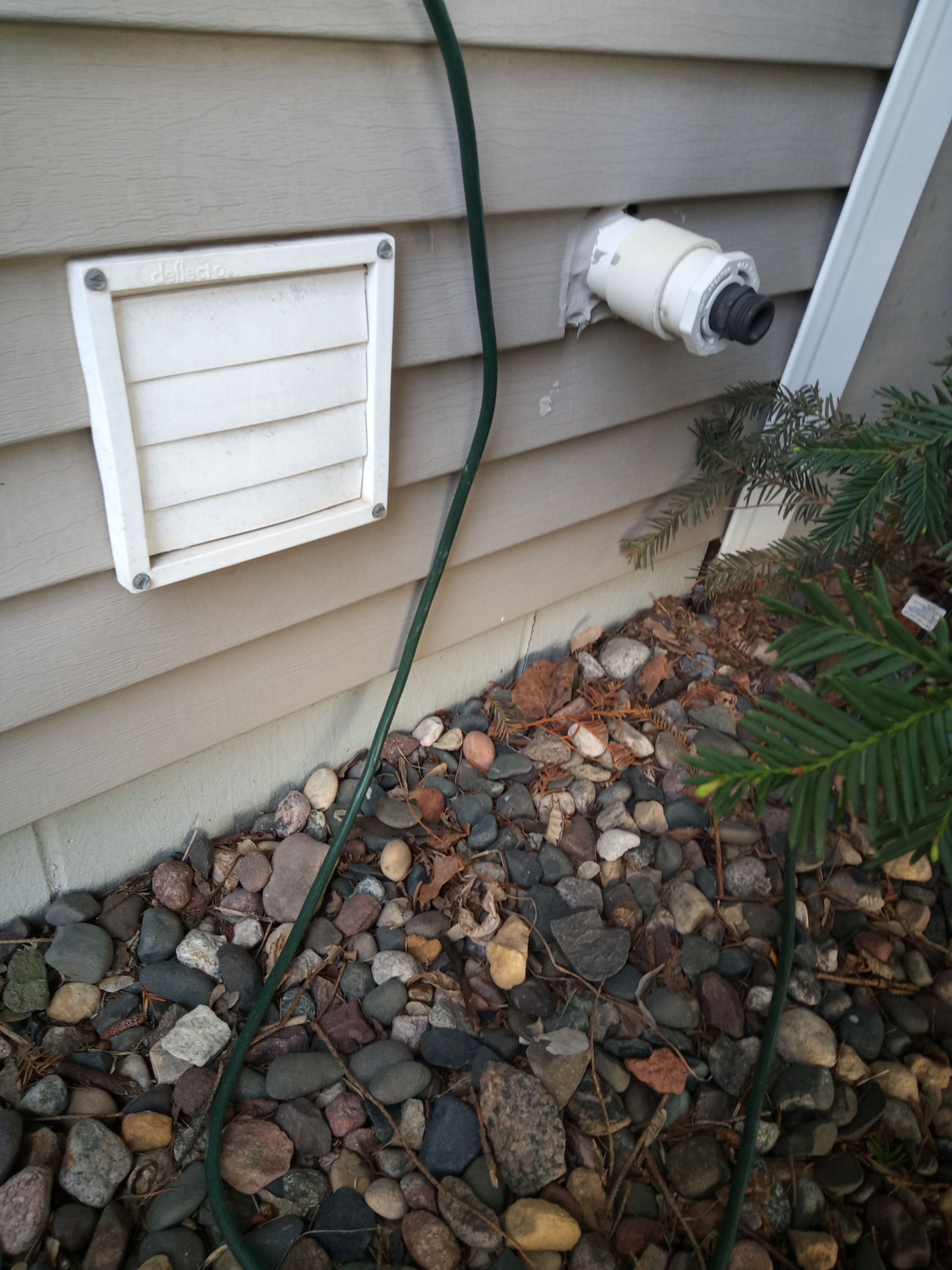 Drain tile discharge is right next to foundation crack.