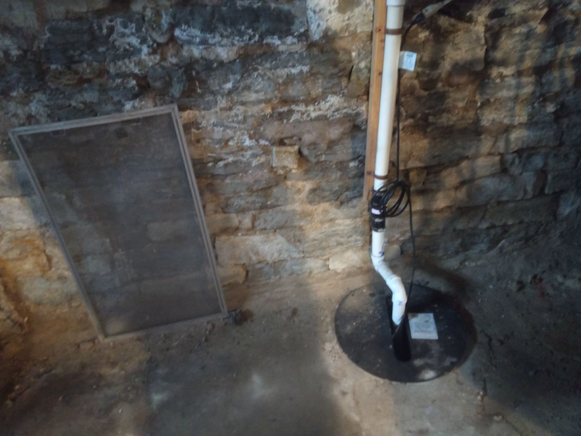 Stone foundation is leaking above the floor.