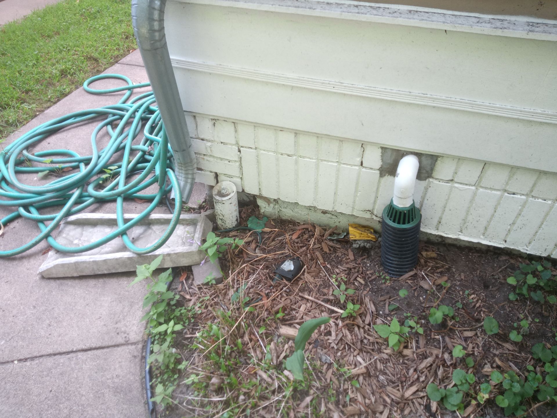 Drain Tile Discharge Next to Foundation Damage