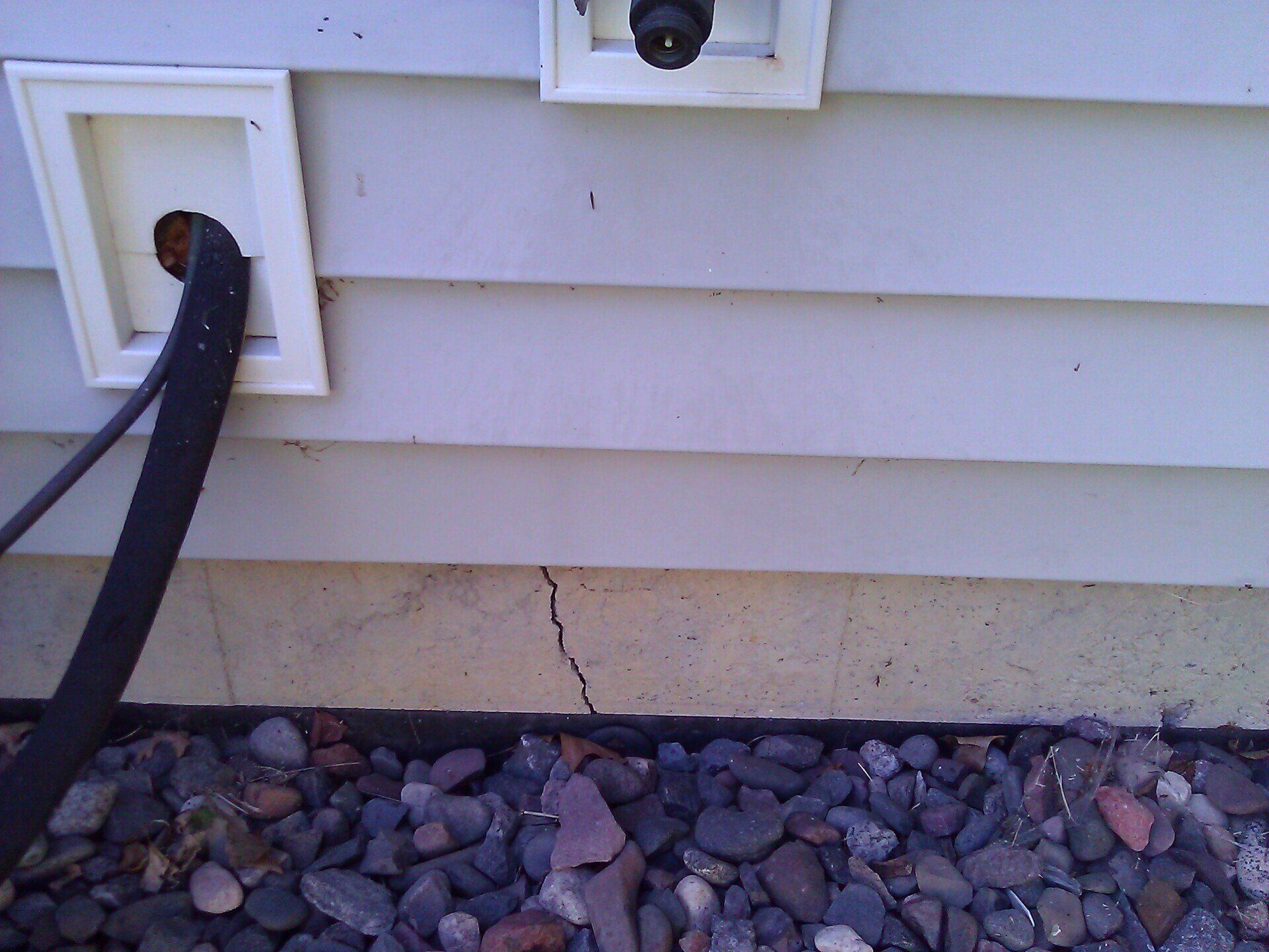 Foundation Crack Near Hose Connection Leaking Water