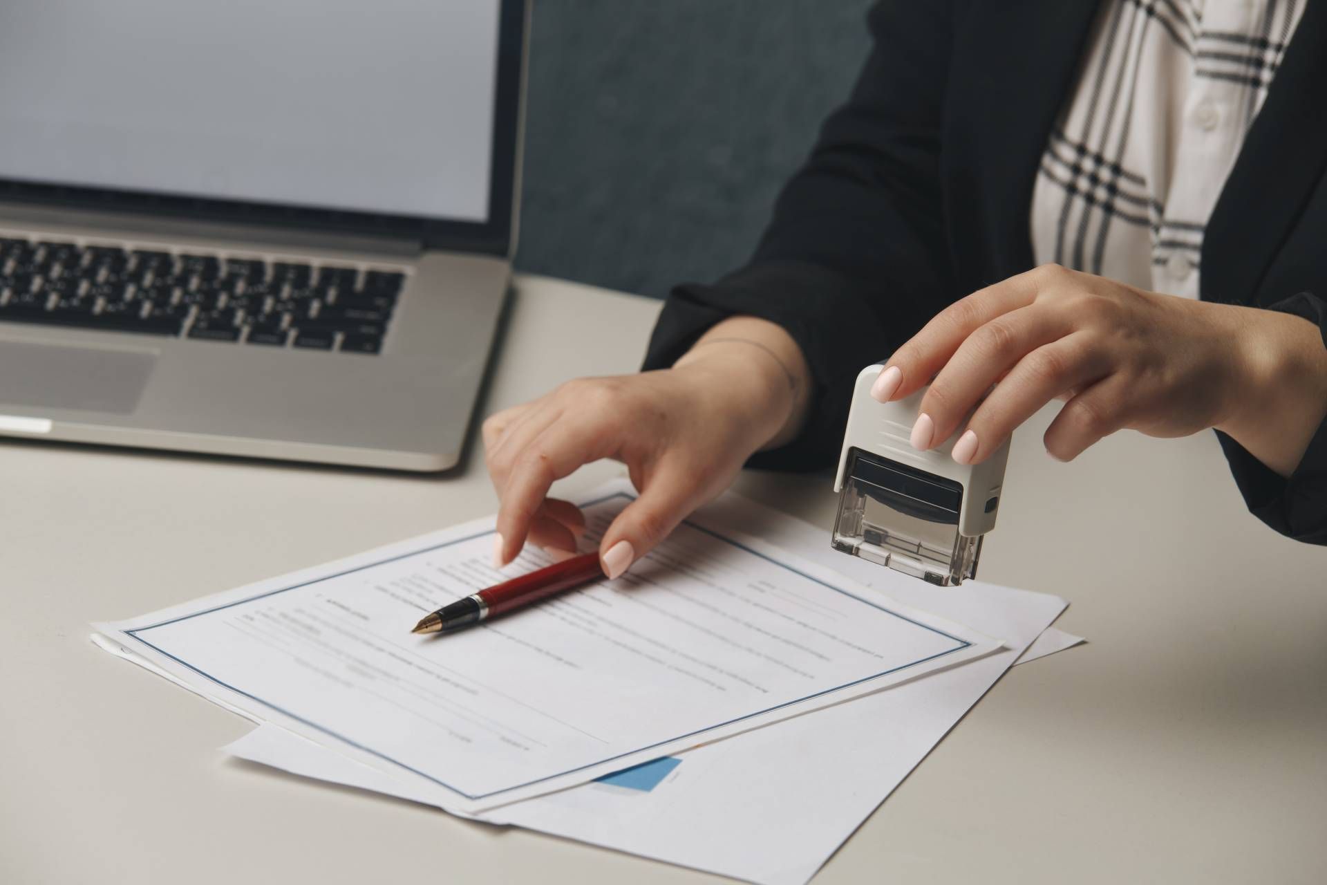 a person stamping documents