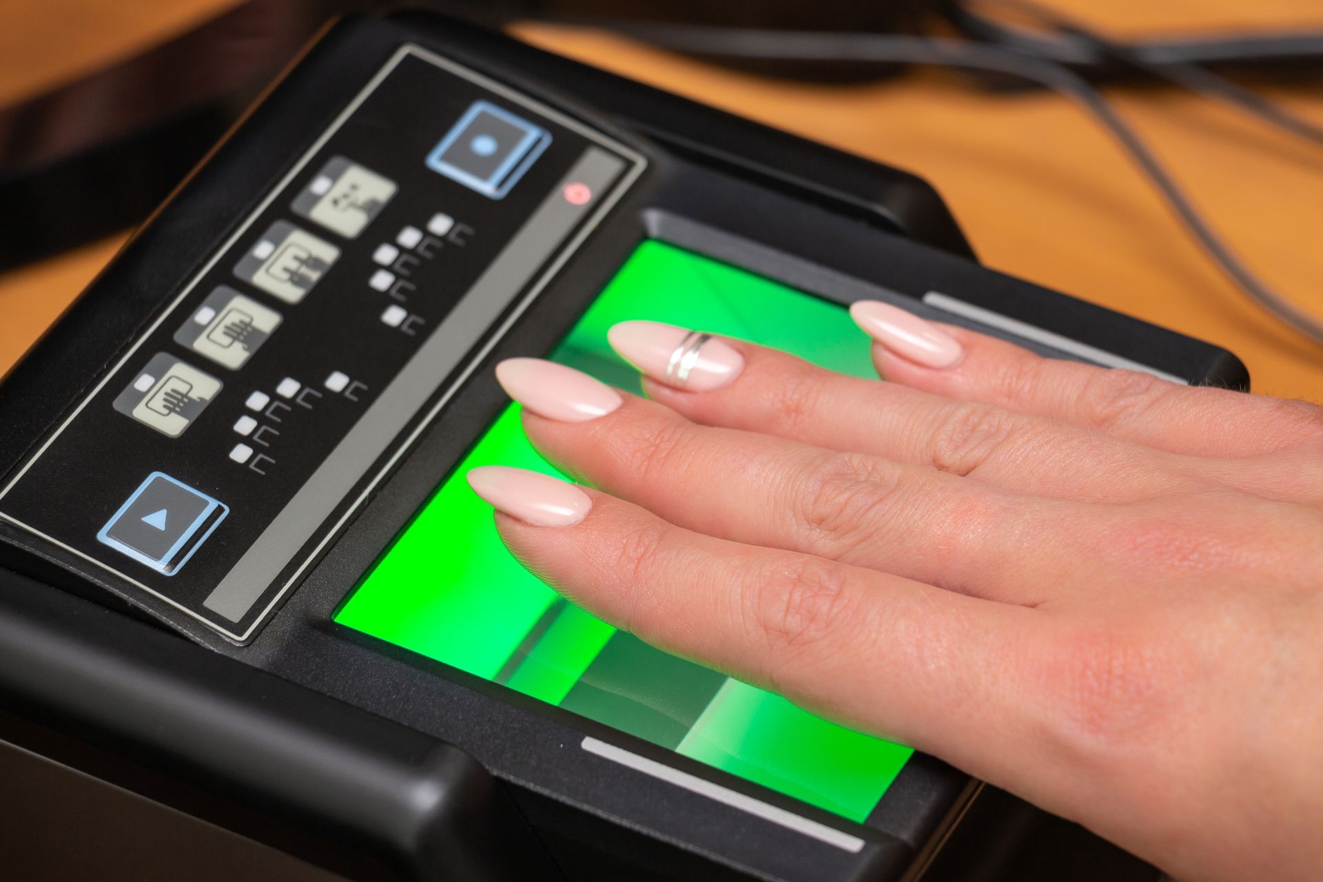 a person using an ink pad for fingerprints