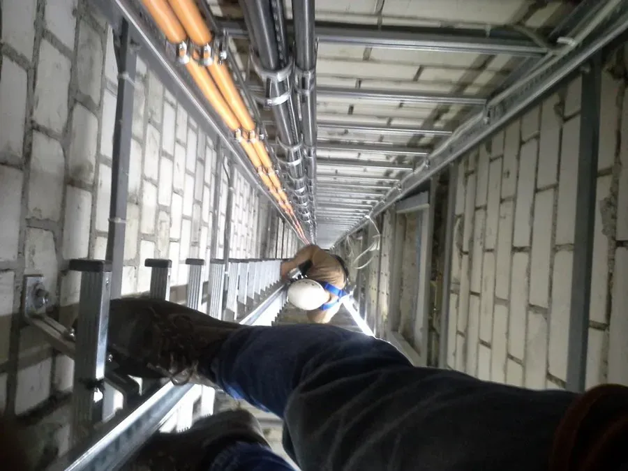 Inspection of vertical ladders including climbing protection