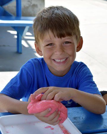 Kindergarten student receives promotion diploma